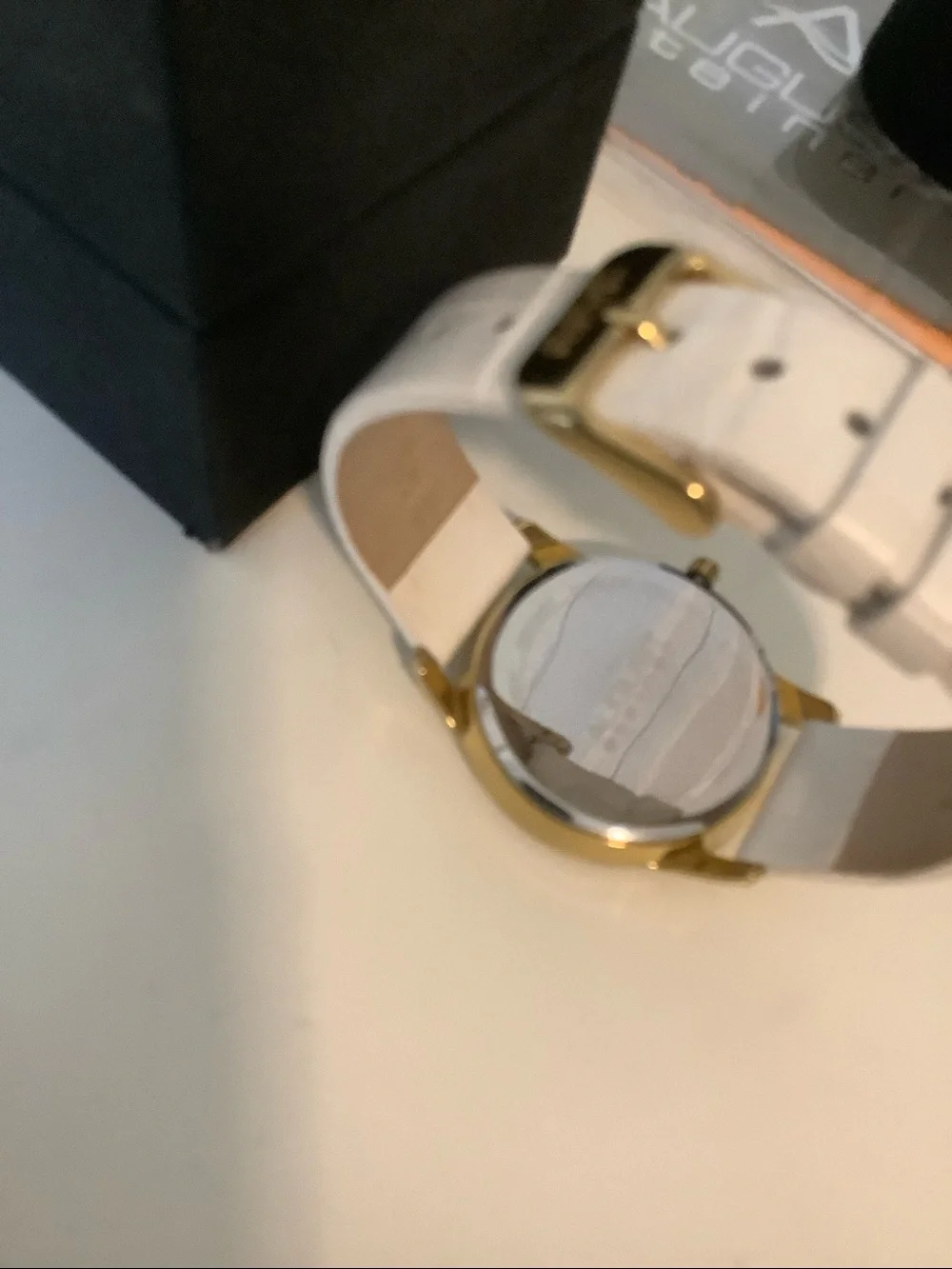 August Steiner diamond watch. New. White leather band.